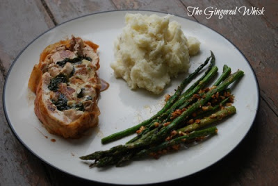 Chicken Ballotine plate with mashed potatoes, roasted asparagus and chicken ballotine slice