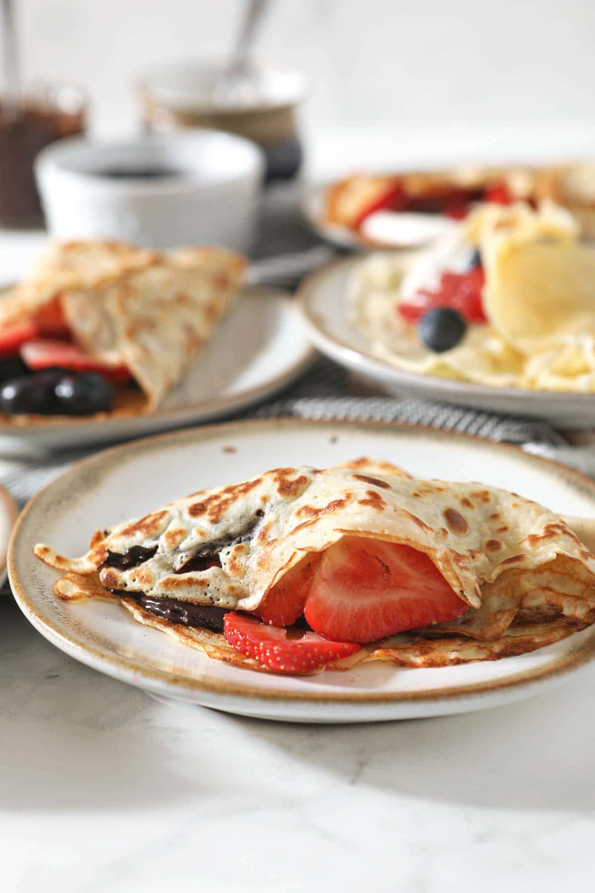 sourdough crepes with berries on plate