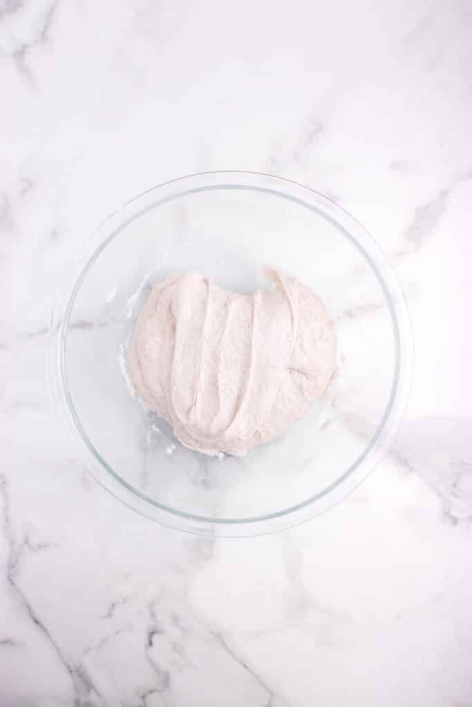 dough after a stretch and fold in a glass bowl