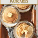 stacks of sourdough pancakes with text overlay for pinterest
